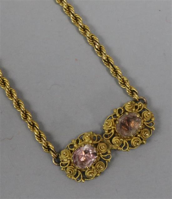 A gem-set yellow metal ropetwist necklace (converted from a pair of earrings).